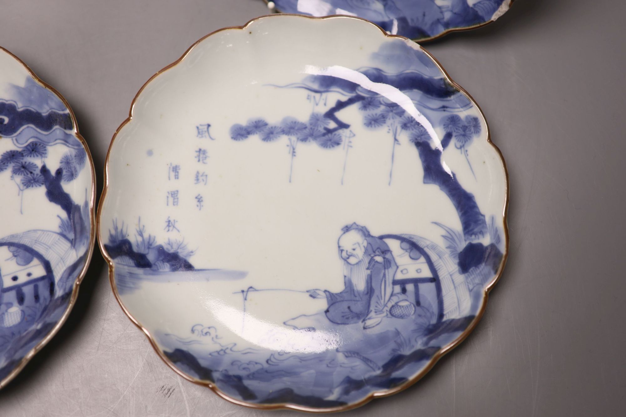 A set of four 17th century Japanese Arita blue and white plates, diameter 21cm